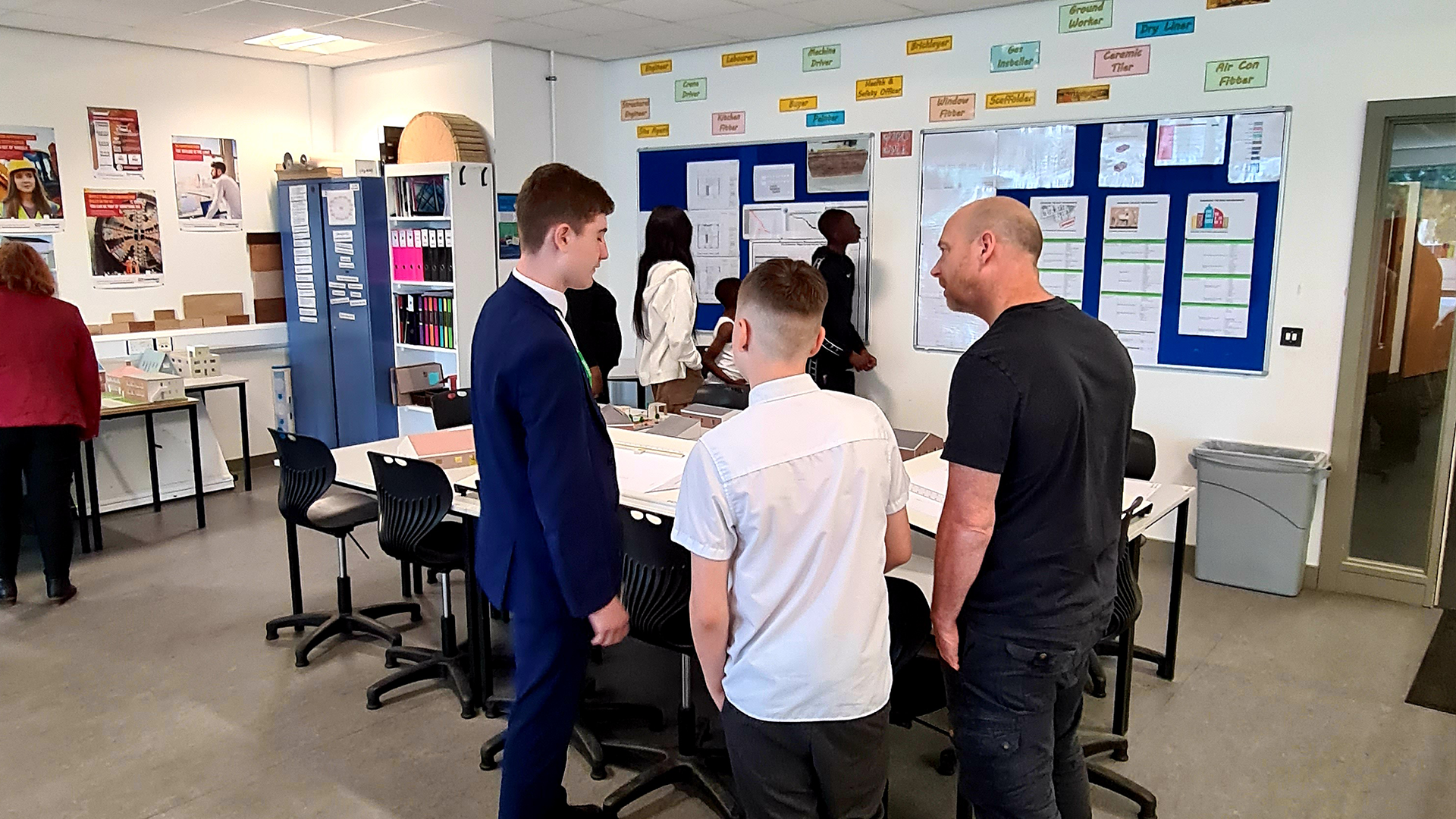 Student talking to parent and student