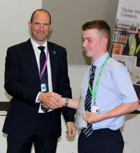 Principal congratulates an Able and qualified Student Ben Ward